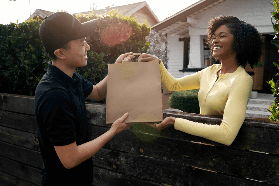delivery person getting parcel out delivery